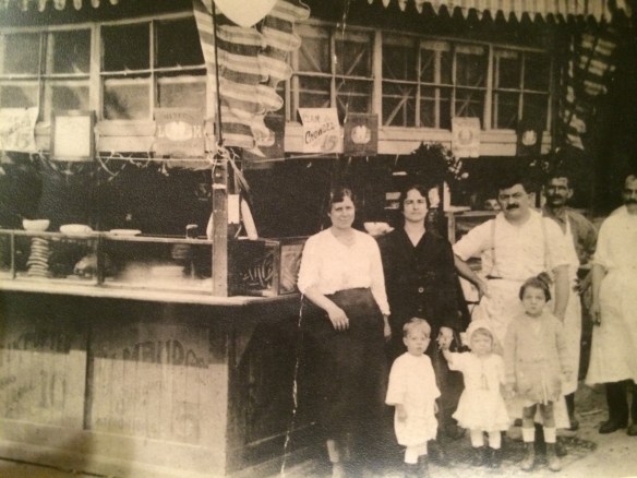 1919 Coney Island, kiosk of John Andrew Kostakos. left: Hariklia Aridas Kostakos and in front of her, Andrew John Kostakos, my father